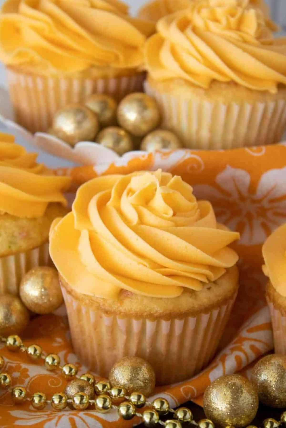 Orange Buttercream Frosting on cupcakes.