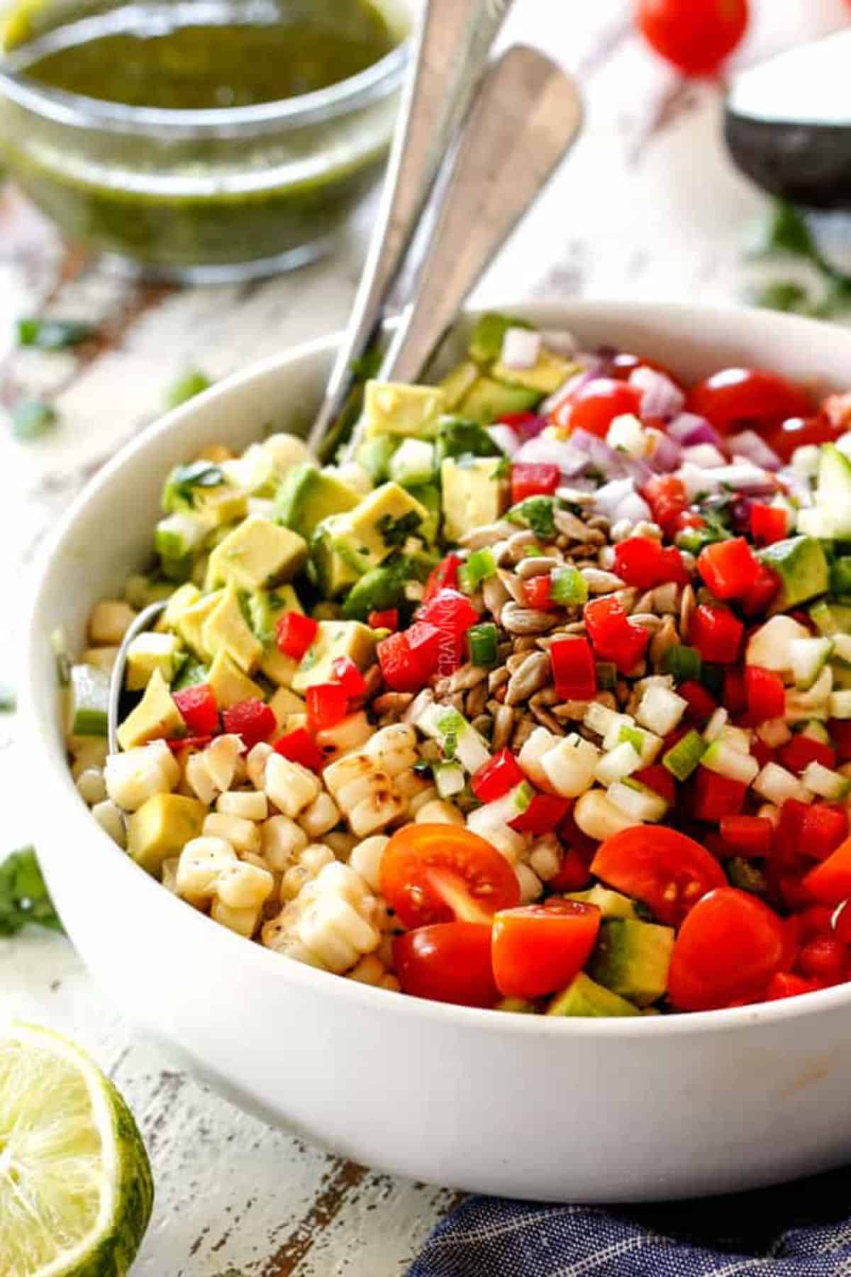 Corn Salad with Cilantro Lime Dressing in a white bowl.