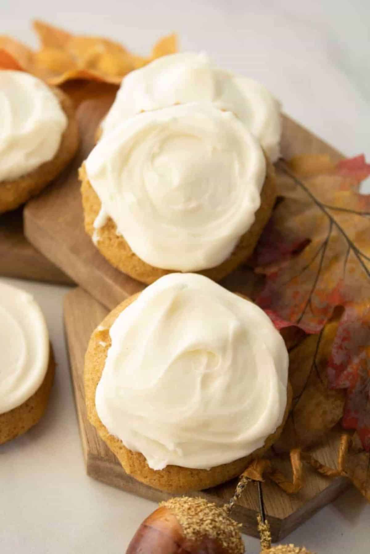 A bunch of delicious Cream Cheese Frosted Pumpkin Cookies.