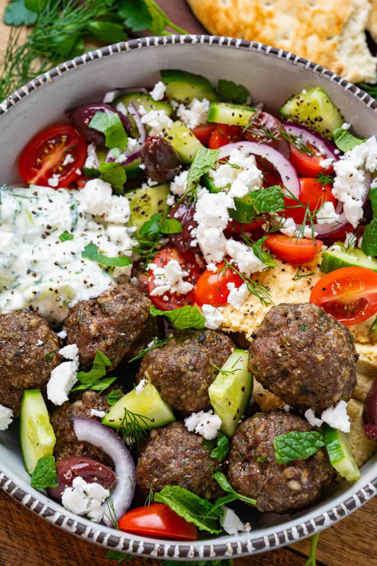 Dill and Feta Meatballs in a white-gray bowl.