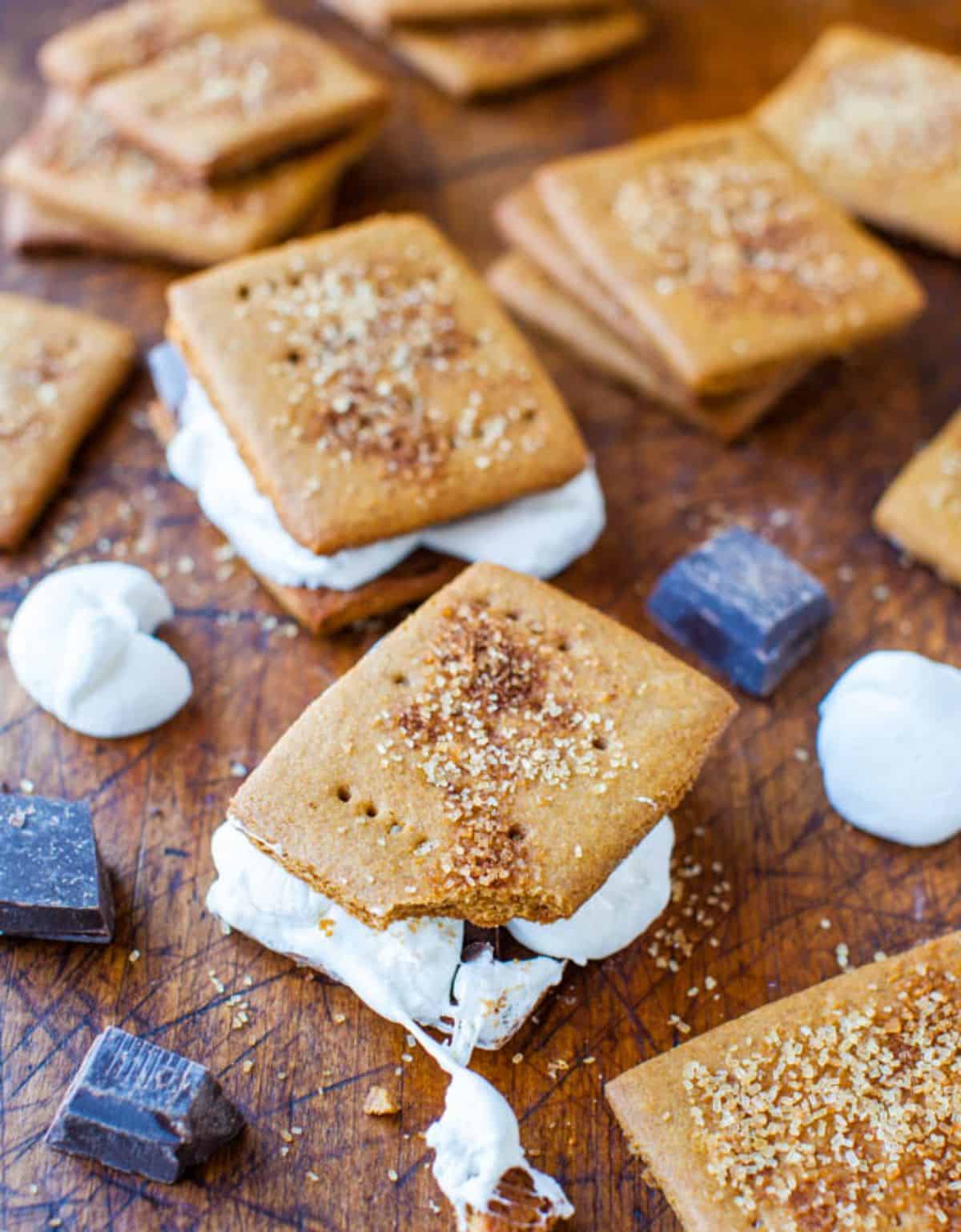 A bunch of Graham Crackers on a wooden tray.