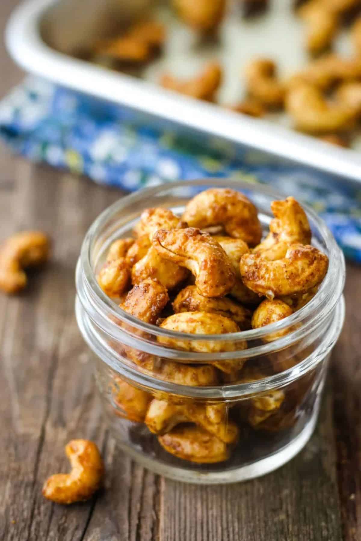 Curry Spiced Cashews in a glass jar.