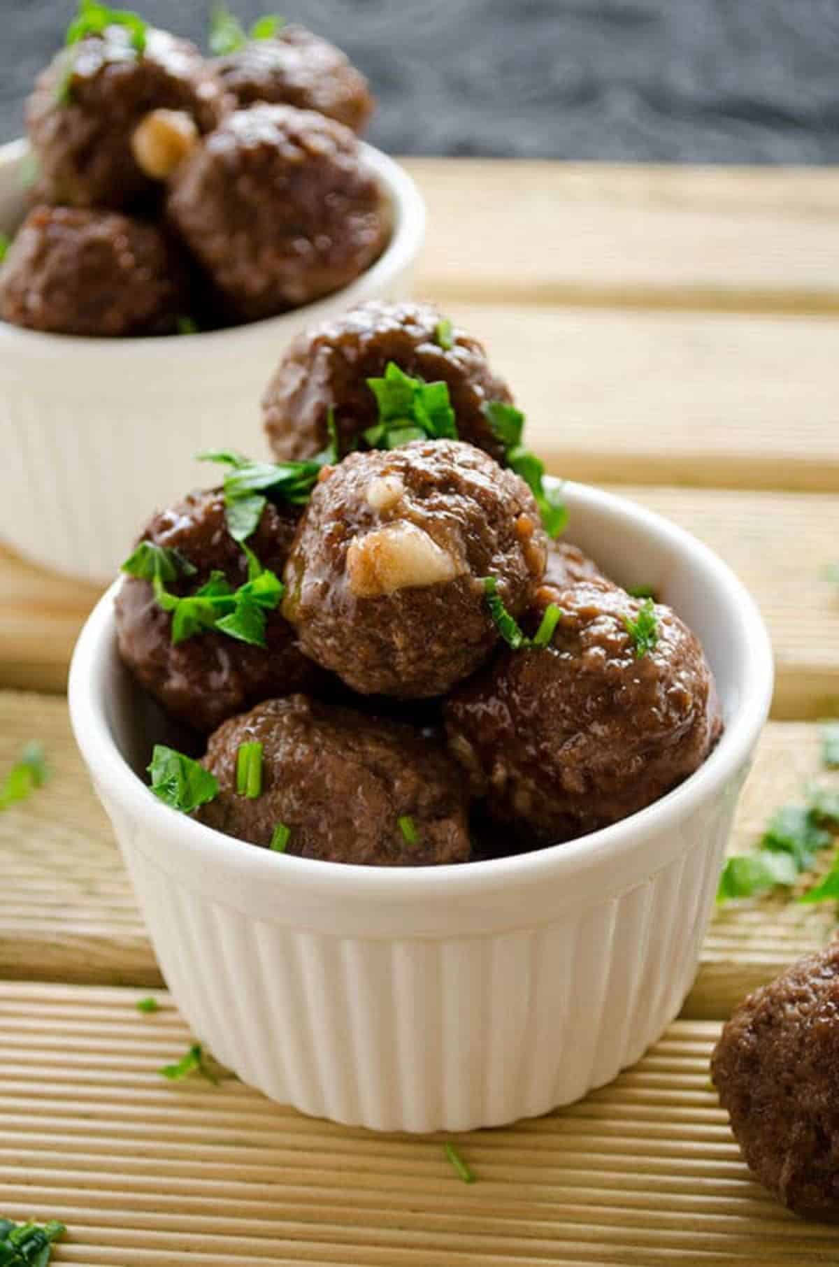 Cheese Meatballs in two small white bowls.