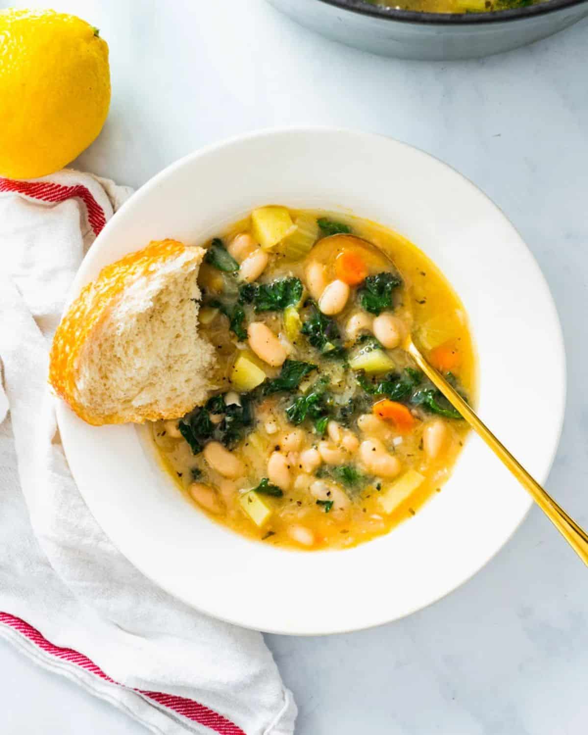 Delicious Cozy White Bean Soup on a white plate.