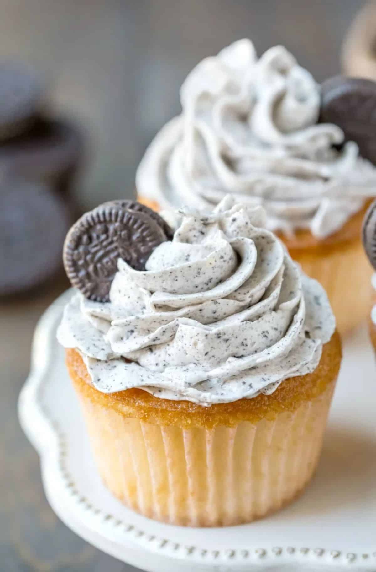 Delicious Cupcakes with Oreo Frosting on a white tray.