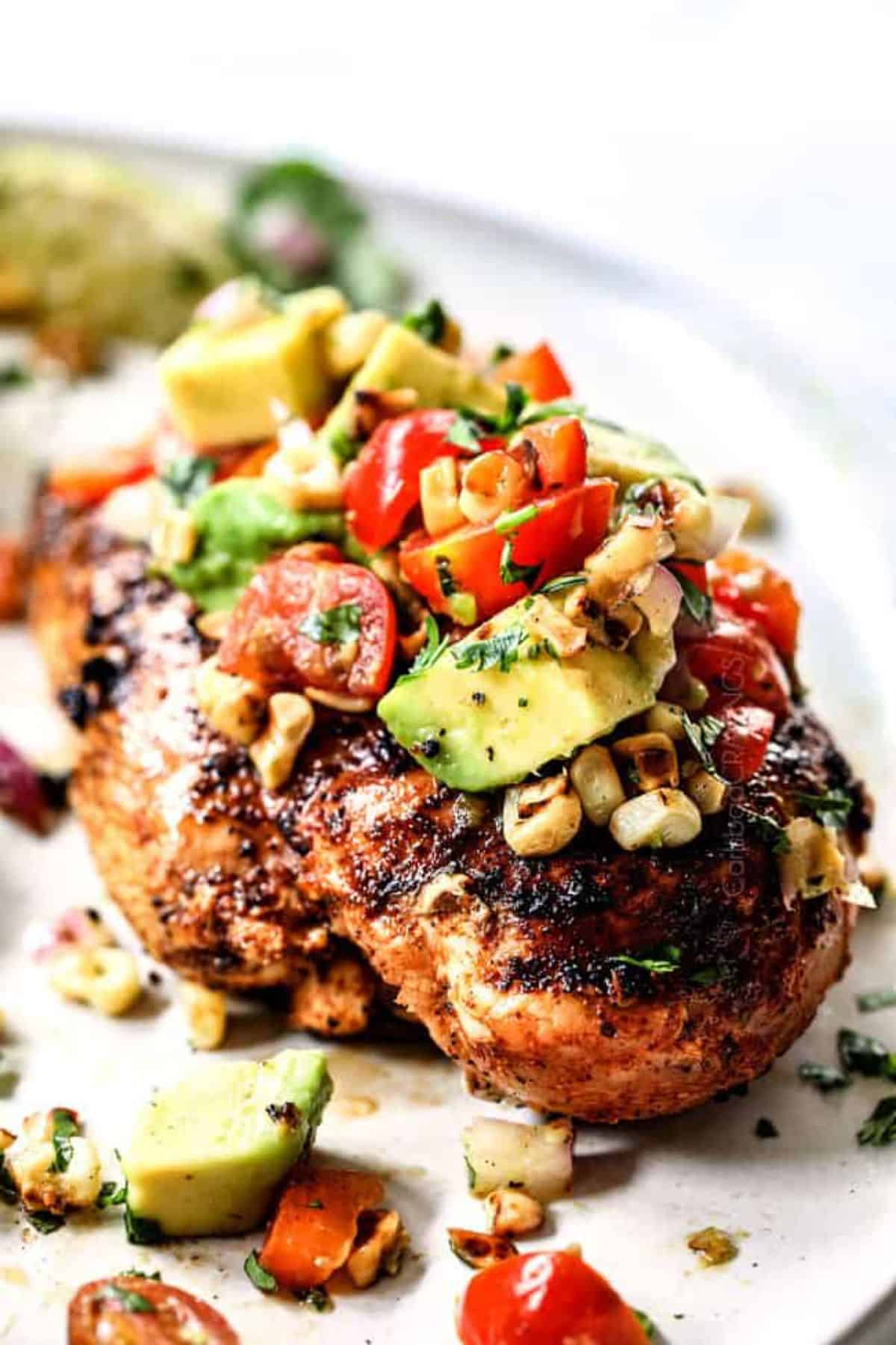 Fiesta Lime Chicken with Avocado Salsa on a white plate.