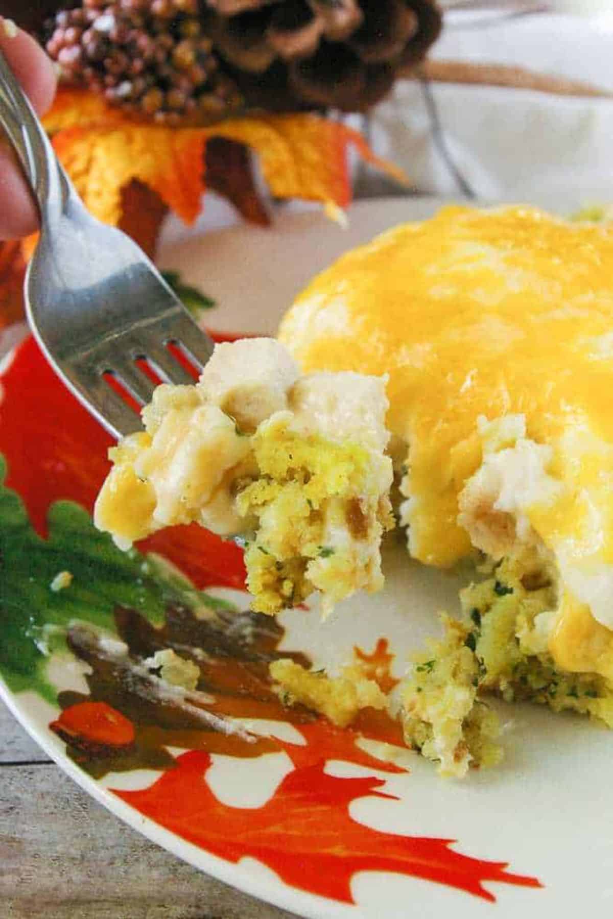 After Thanksgiving Casserole dish on a plate picked with a fork.