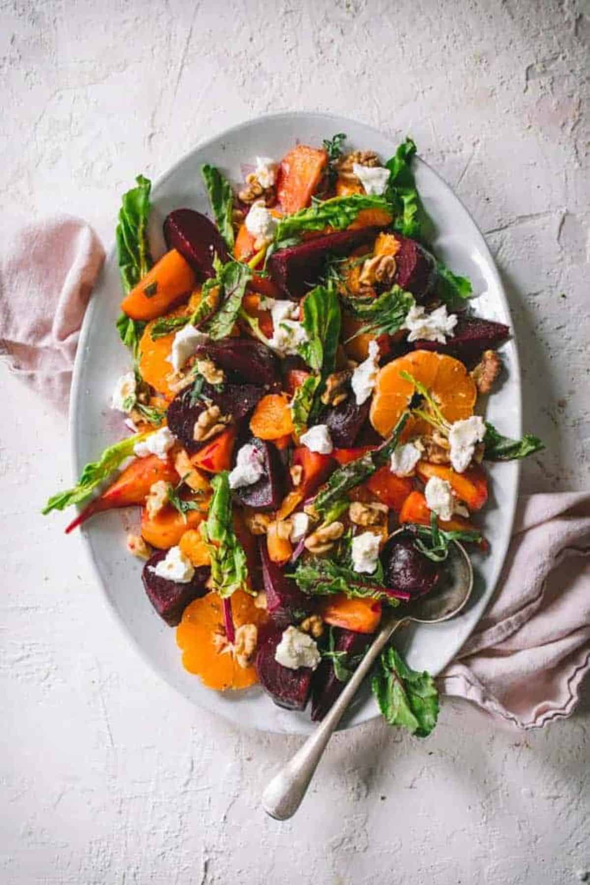Delicious Beet Salad With Citrus Tarragon Dressing on a white tray.