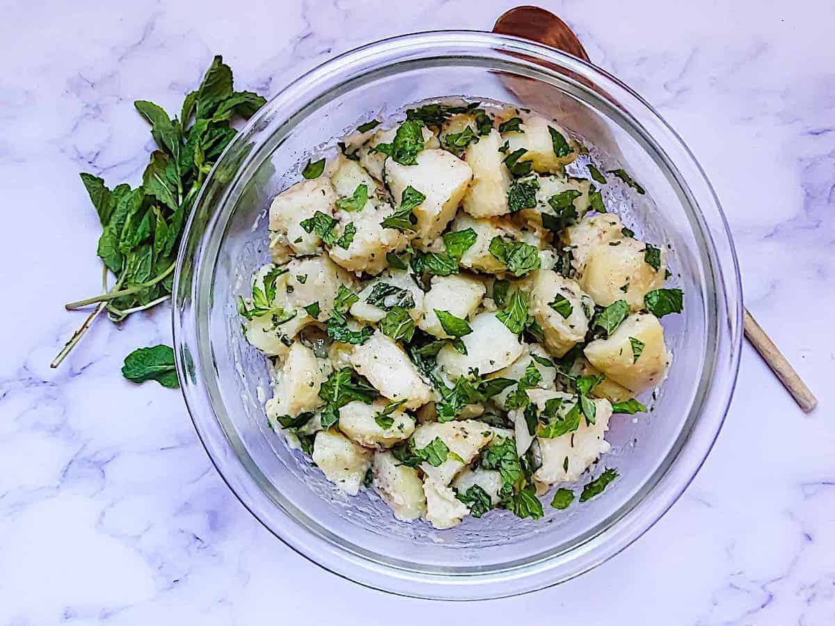 Syrian Potato Salad in a glass bowl.