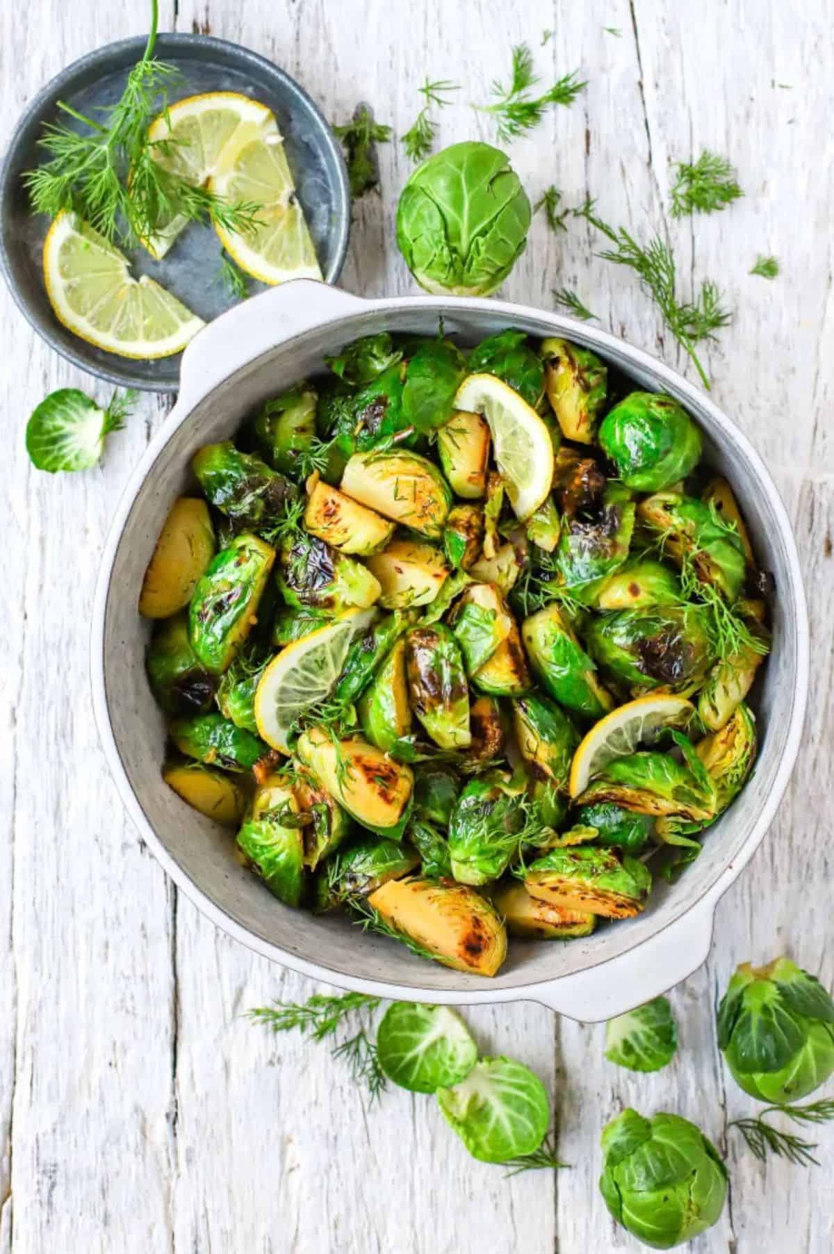 Dill and Lemon Roasted Brussel Sprouts in a white pot.