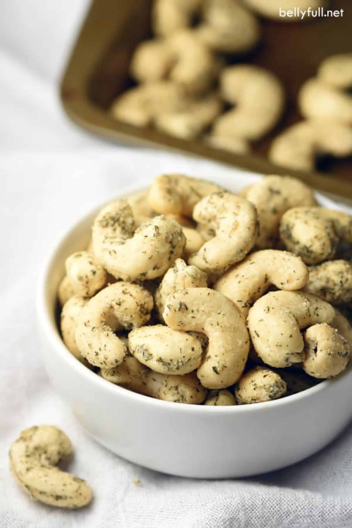 Dill Pickle Cashews in a white bowl.