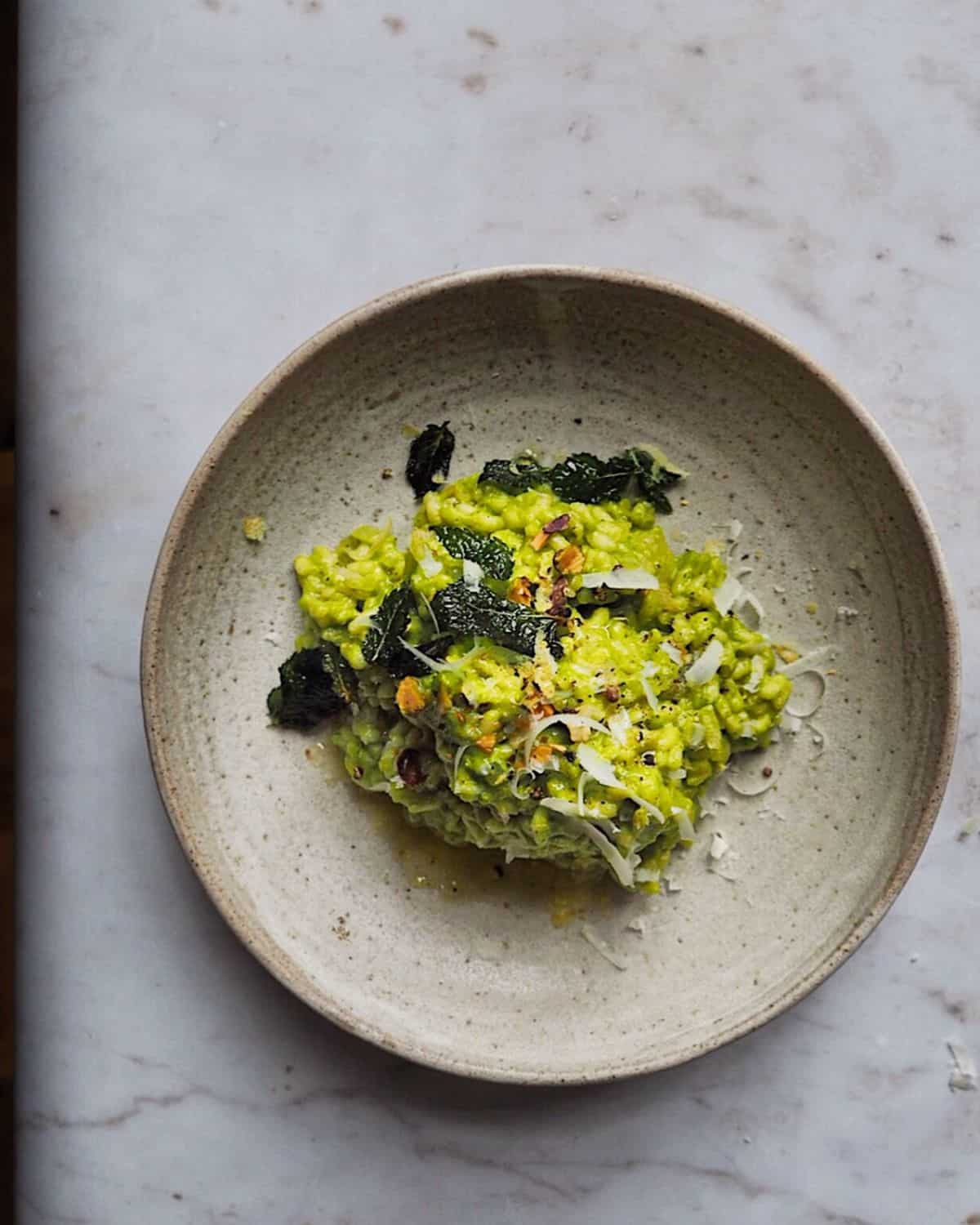 Green Pepper and Pistachio Risotto on a gray plate.