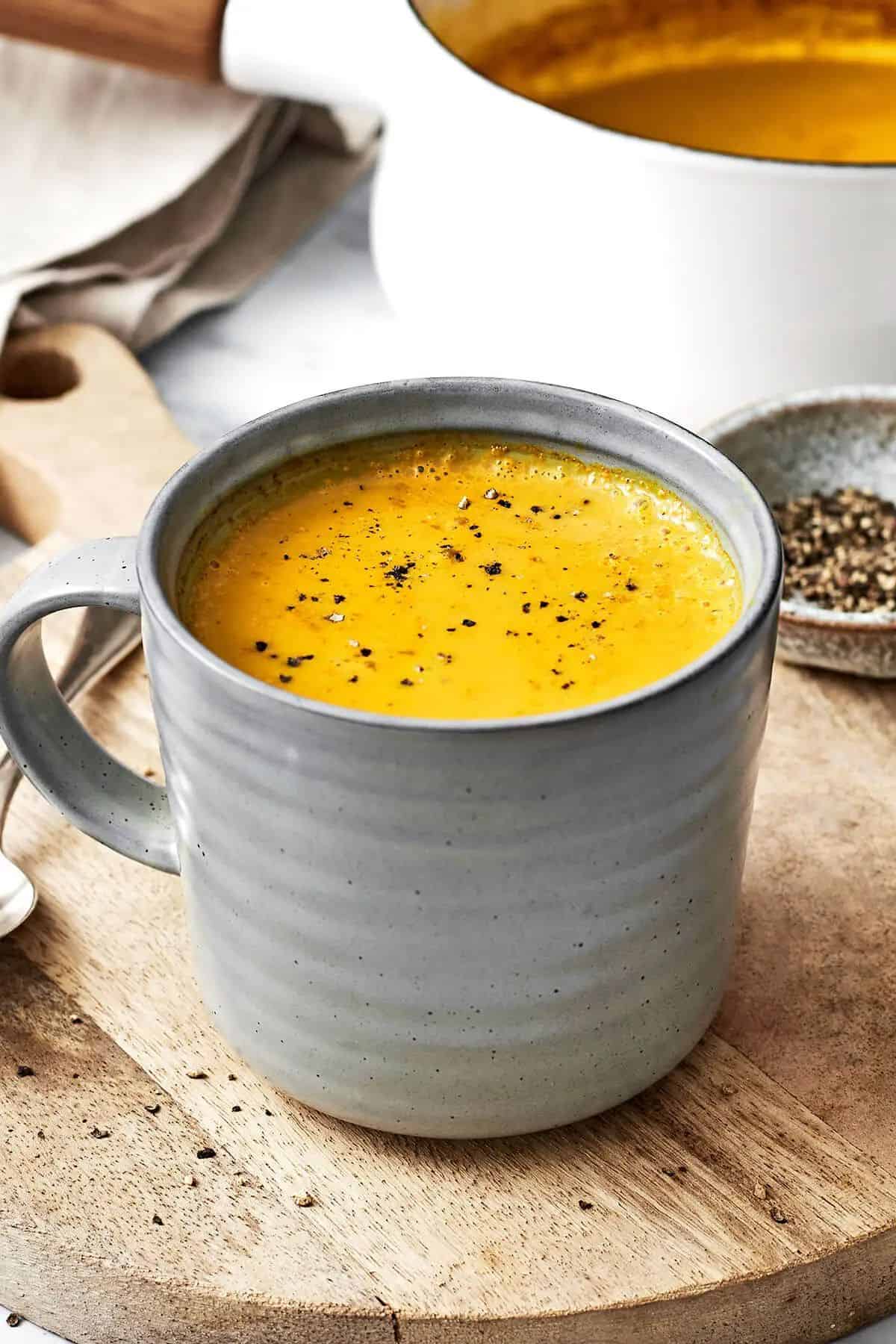 Turmeric Milk in a gray cup.