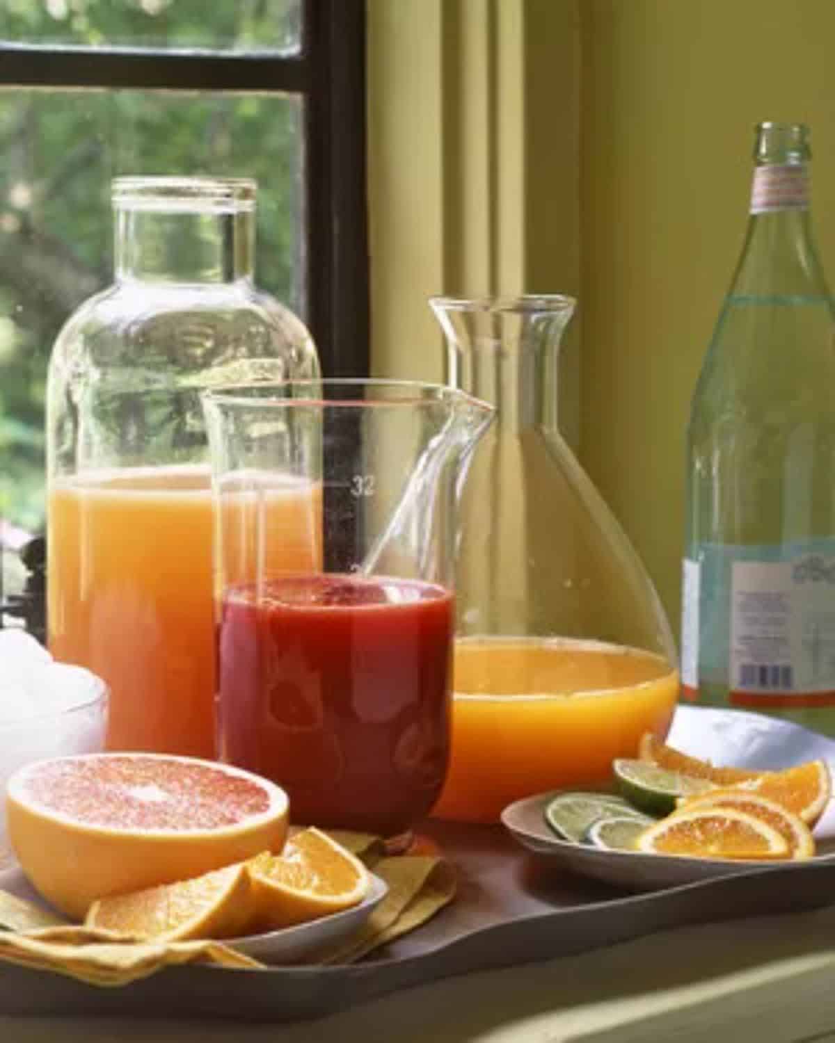 Different types of juices in glass containers.