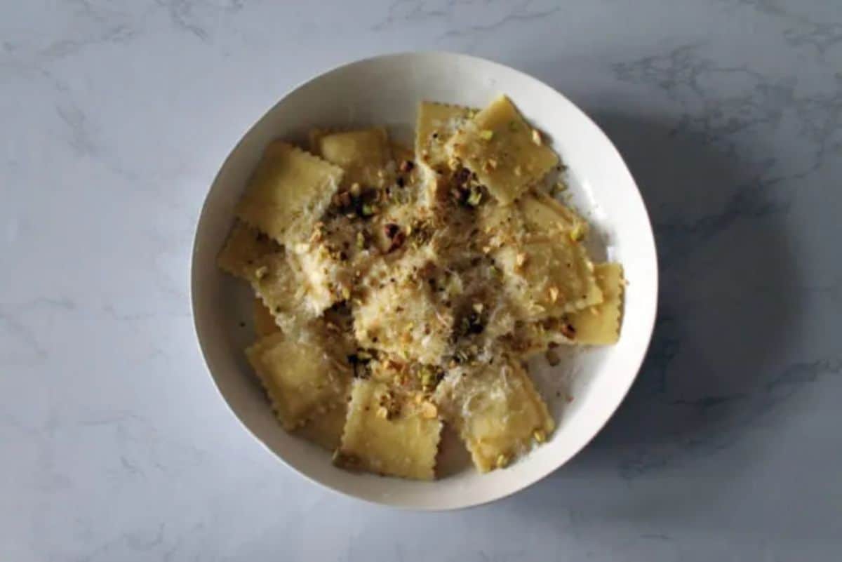 Lemon Pistachio Ravioli in a white bowl.