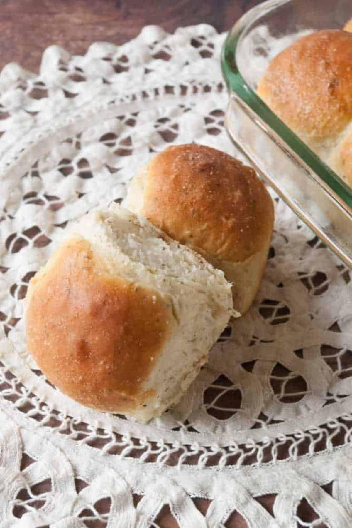 Two Garlic Butter Herb Rolls on a table.