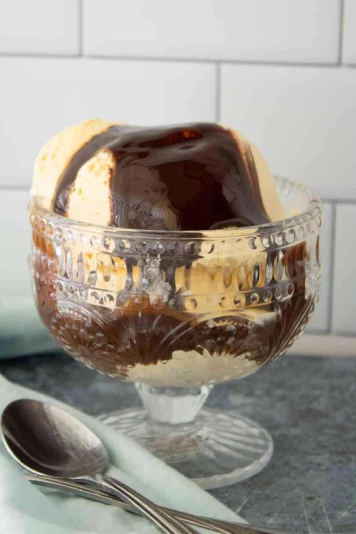 Copycat Hersey's Chocolate Syrup in a tall glass.