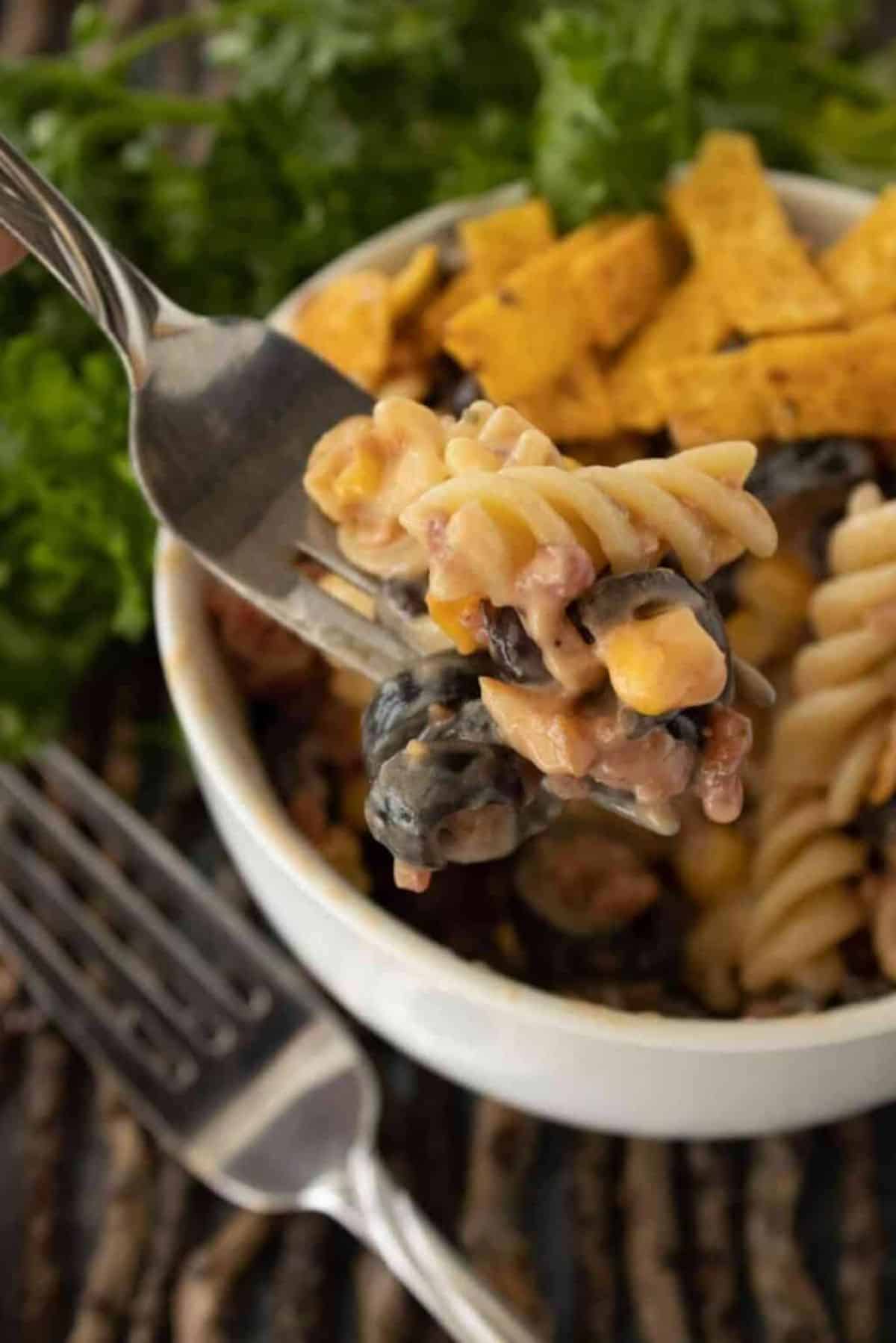 Healthy Barbecue Ranch Pasta Salad in a white bowl and on a fork.