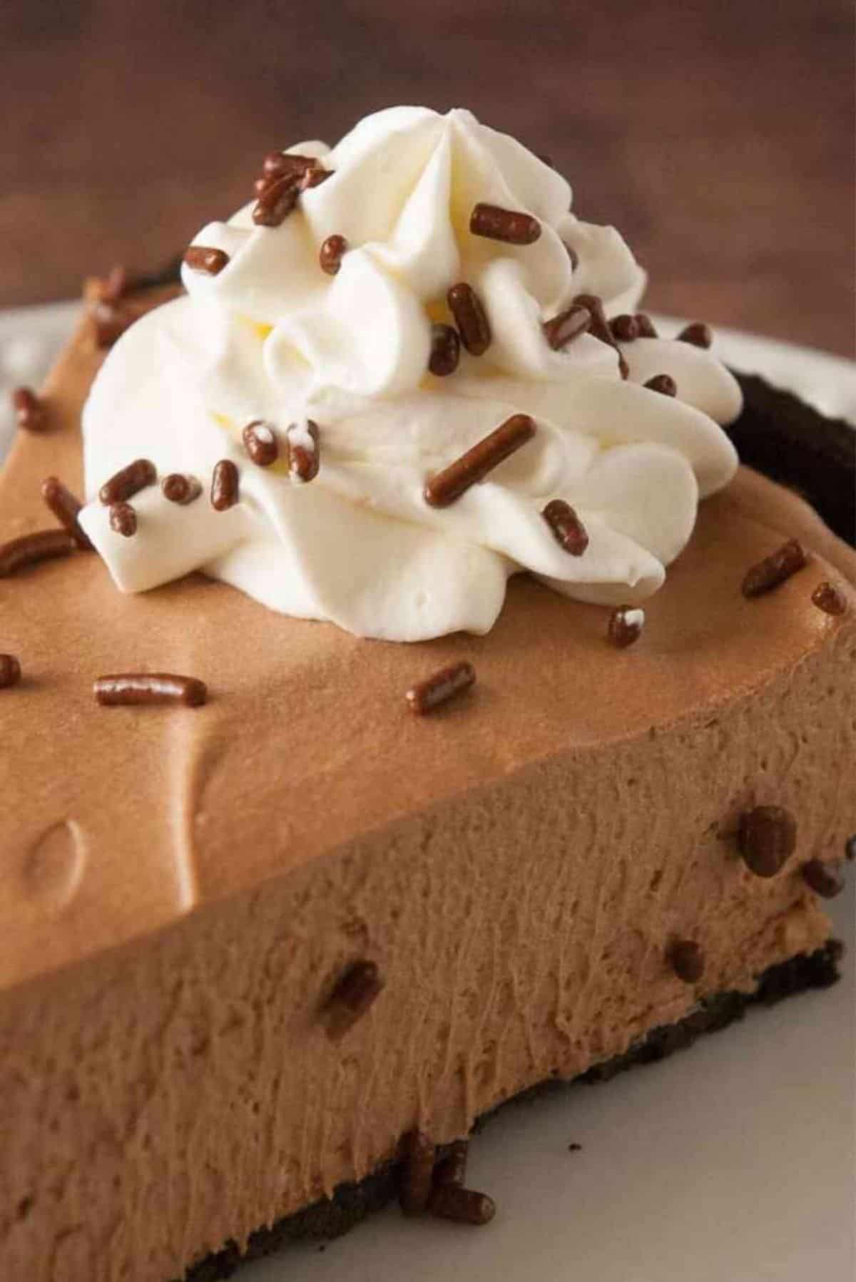 A piece of Irresistible Chocolate Mousse Pie on a white plate.