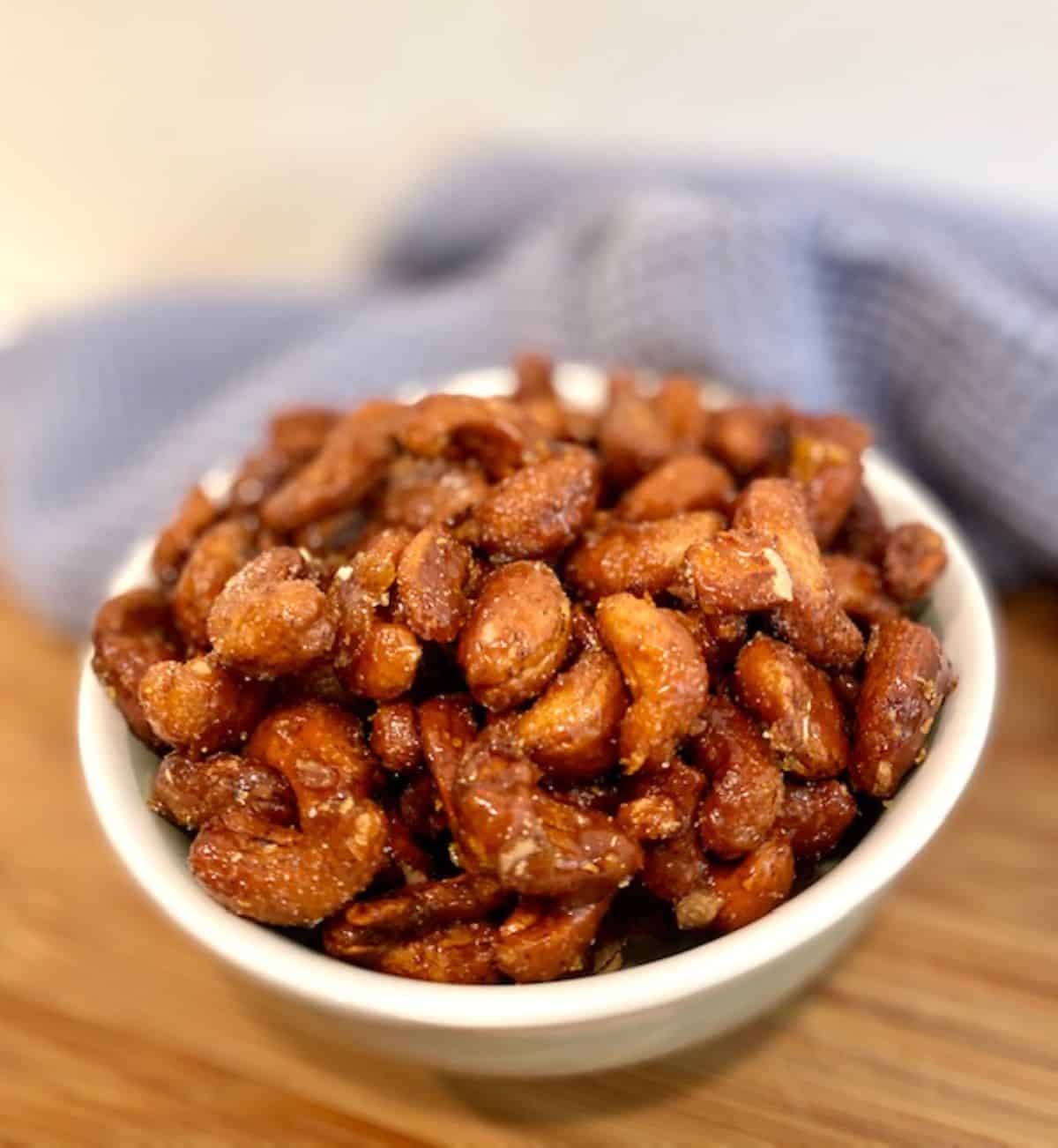 Honey Roasted Cashews in a white bowl.
