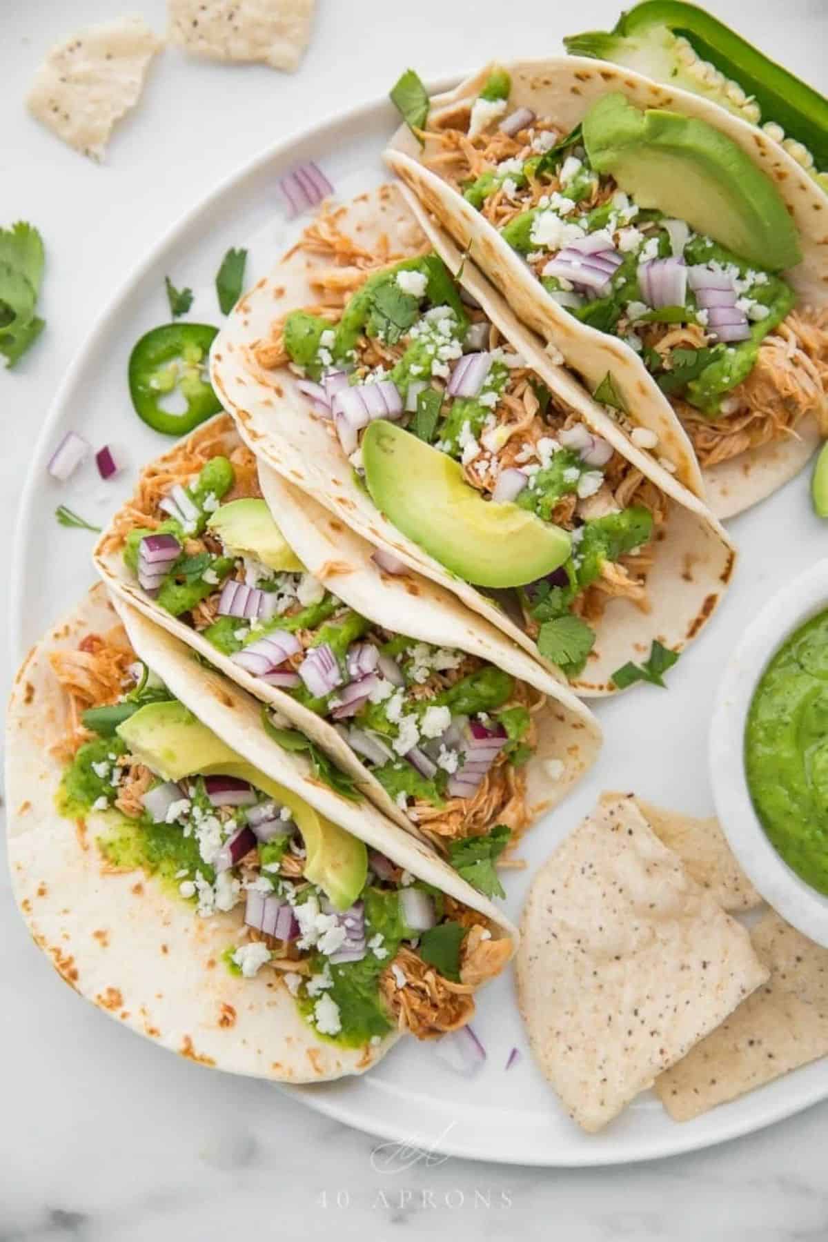 Crockpot Chicken Tacos on a white tray.