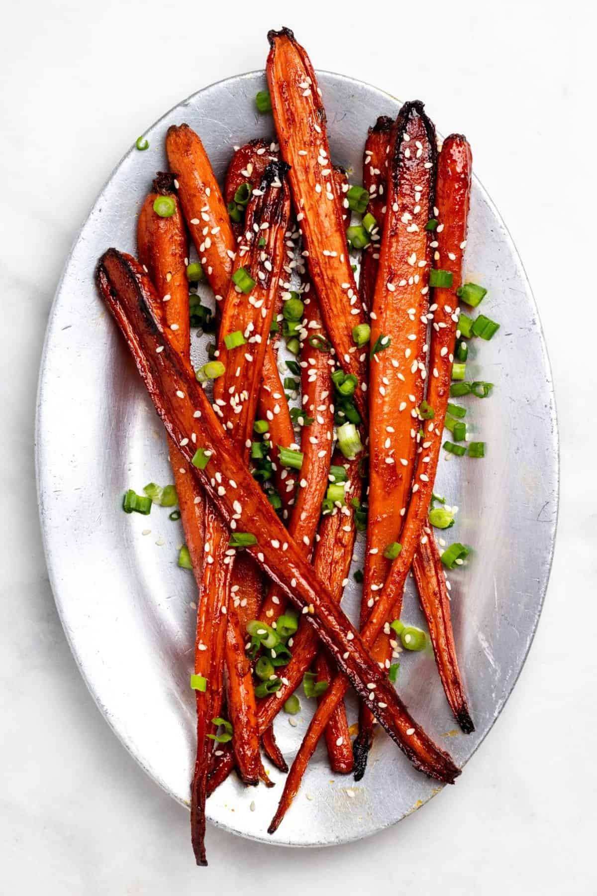 Crunchy Gochujang Roasted Carrots on a metal tray.