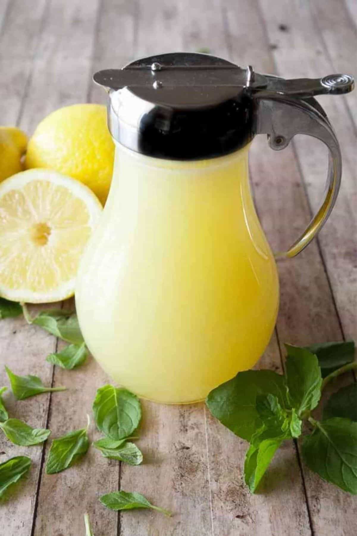 Lemon Cream Syrup in a glass pitcher.