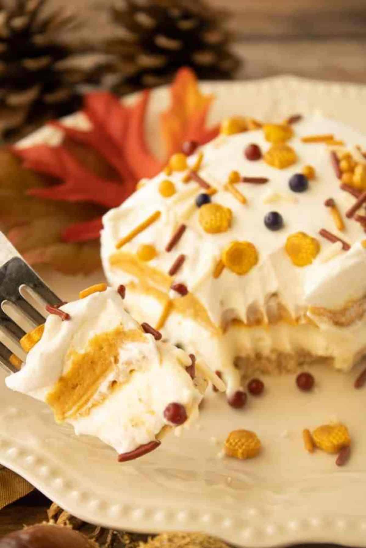 A piece of Pumpkin Lasagna Dessert on a white plate.