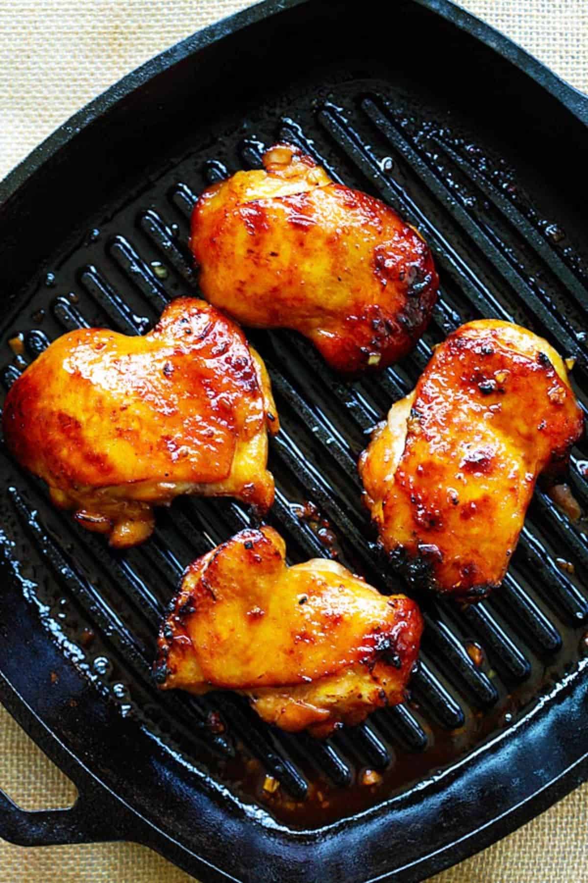 Turmeric Honey Chicken on a skillet.