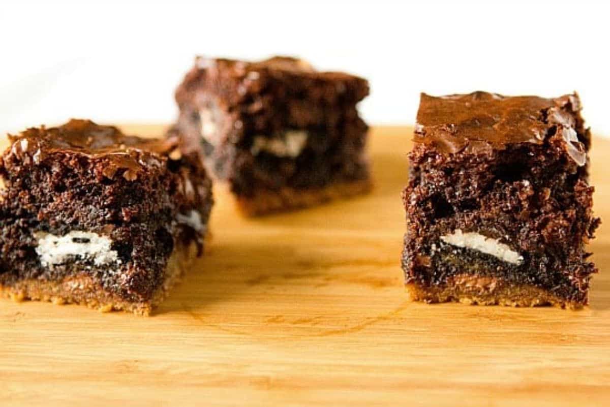 Chocolate Chip Cookie & Oreo Bars on a wooden tray.