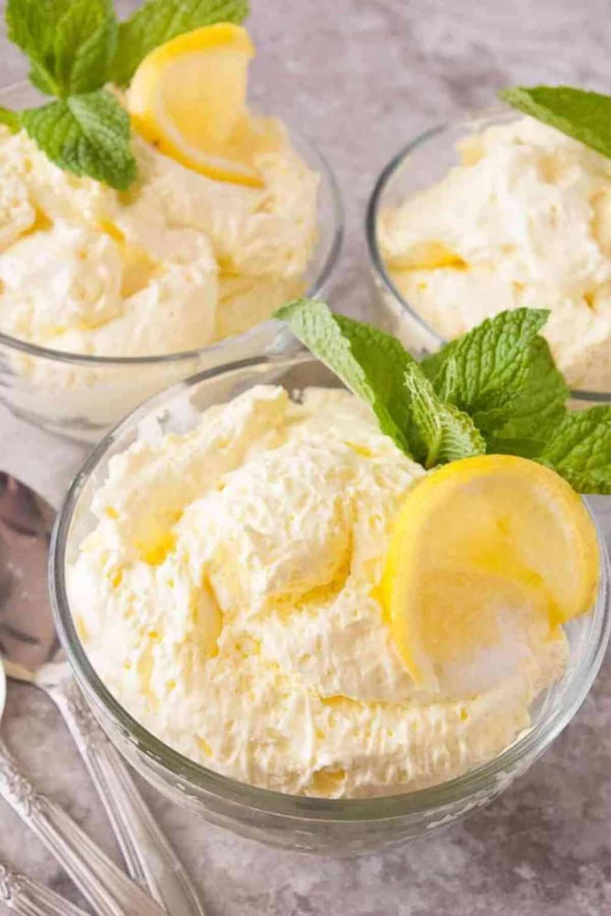 Fluffy Lemon Jello Salad in three glass bowls.