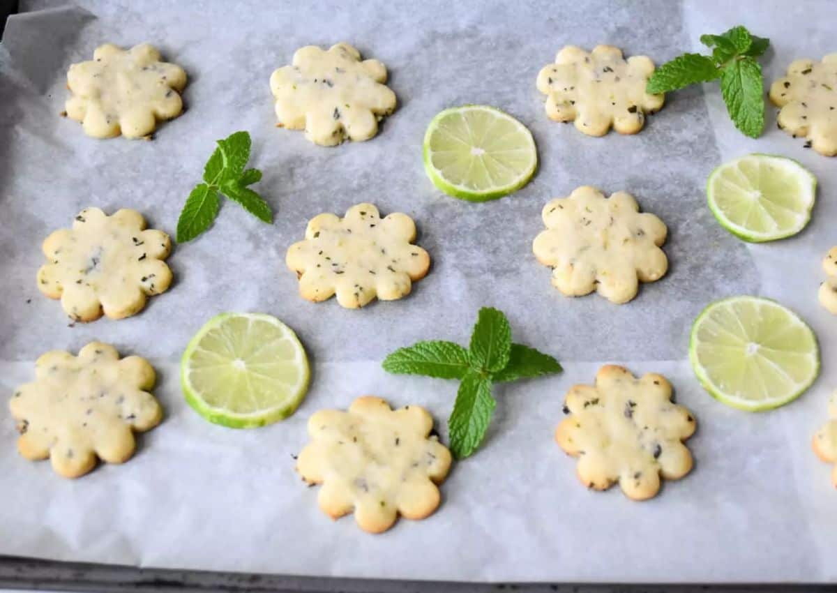 Fresh Mint and Lime Shortbread Cookies on a baking paper.