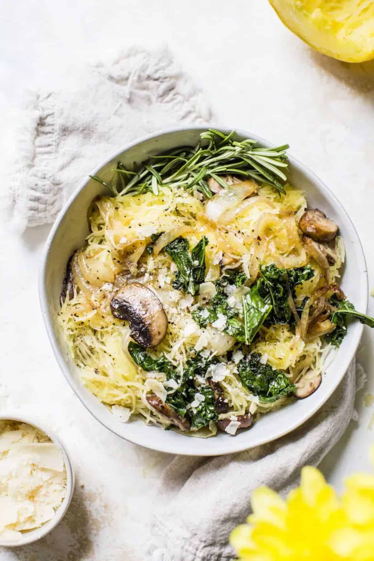 Healthy Caramelized Onion Spaghetti Squash in a white bowl.