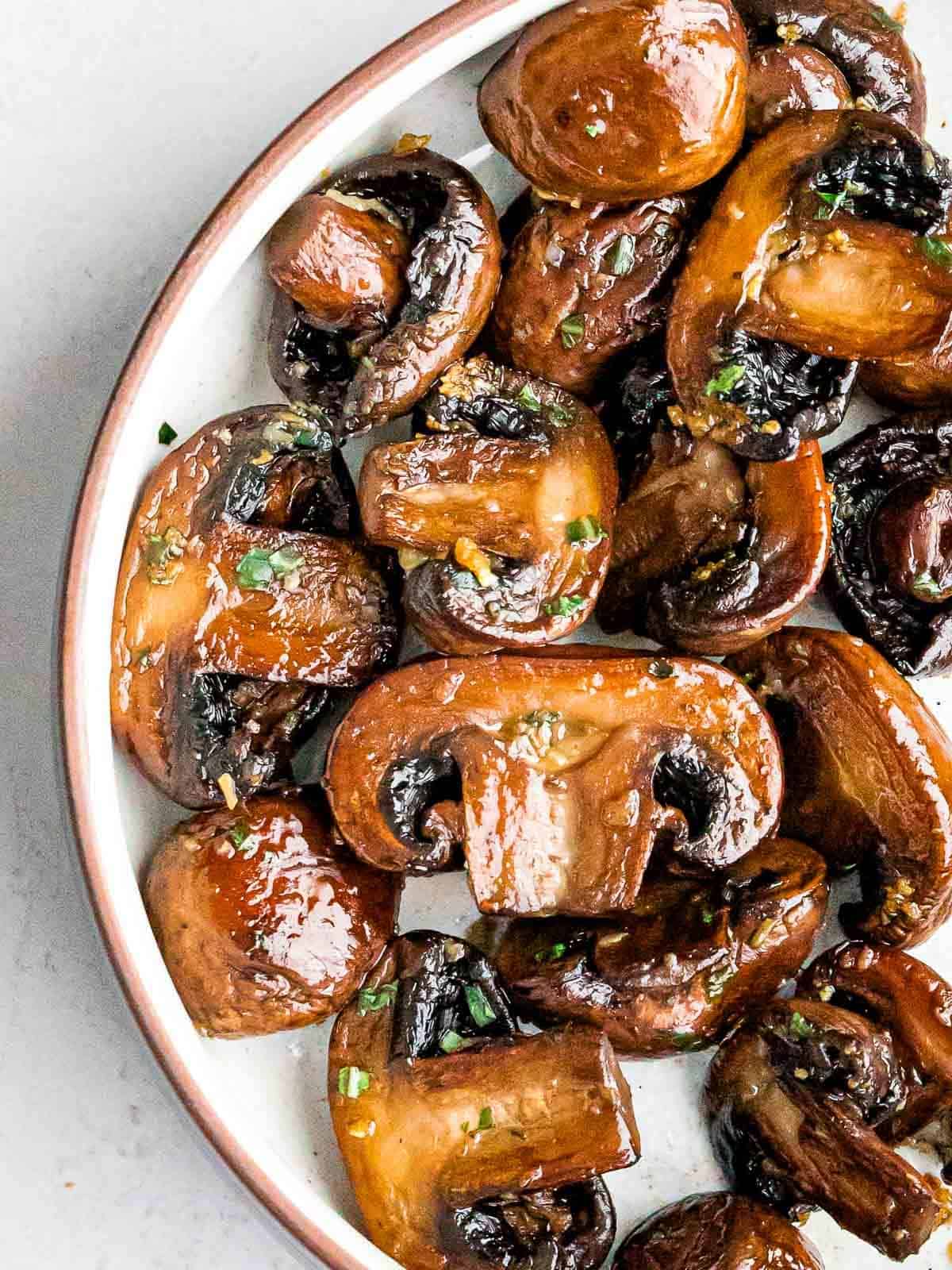 Healthy Easy Sauteed Mushrooms With Garlic Butter on a tray.