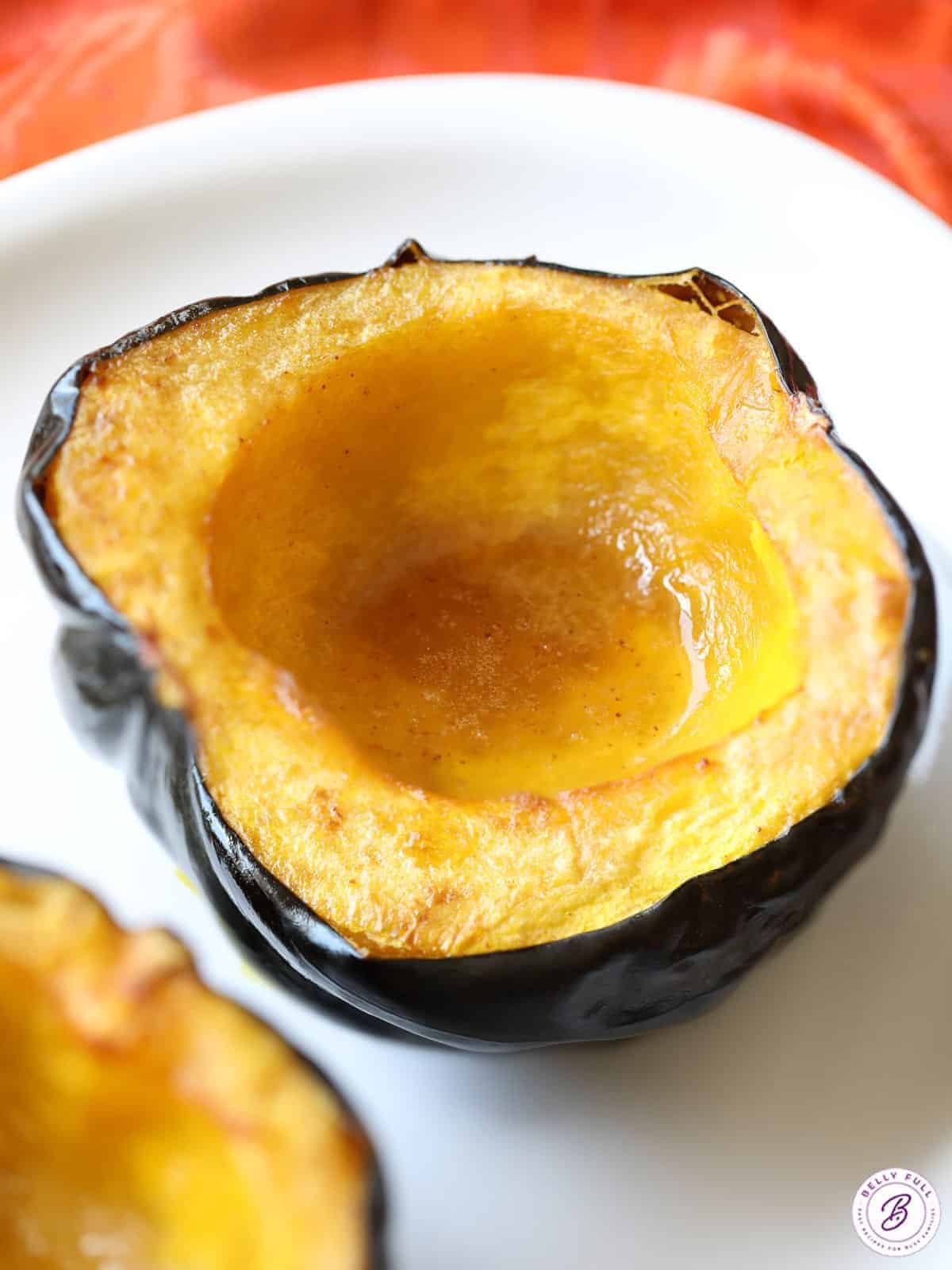 Delicious Roasted Acorn Squash on a white plate.