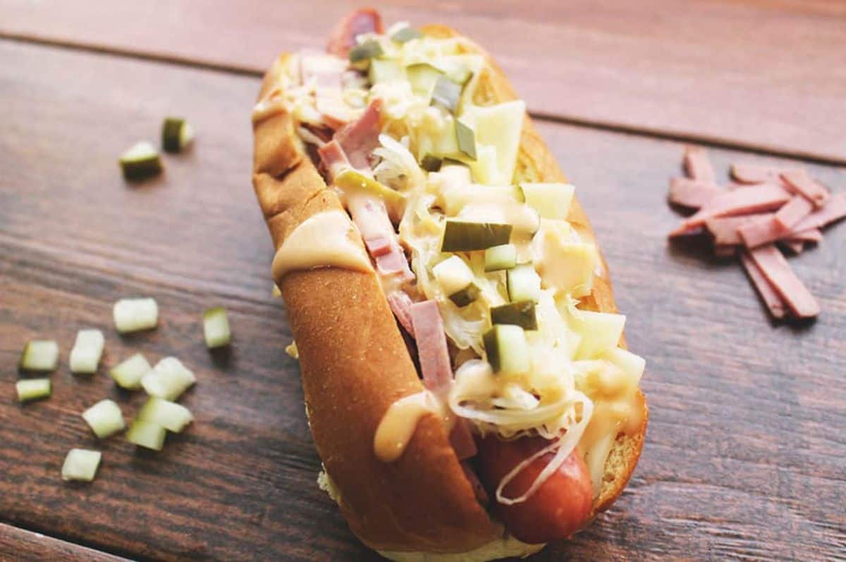 Crunchy Reuben Dog on a wooden table.