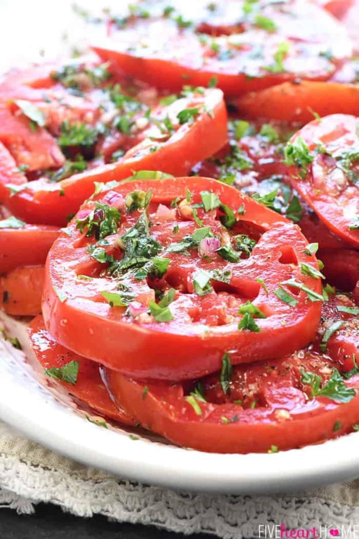 Healthy Marinated Tomatoes on a white tray.
