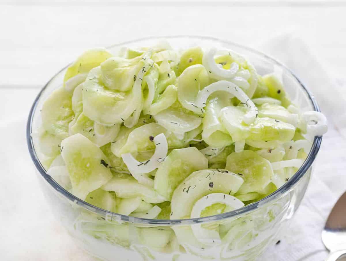 Healthy German Cucumber Salad in a glass bowl.