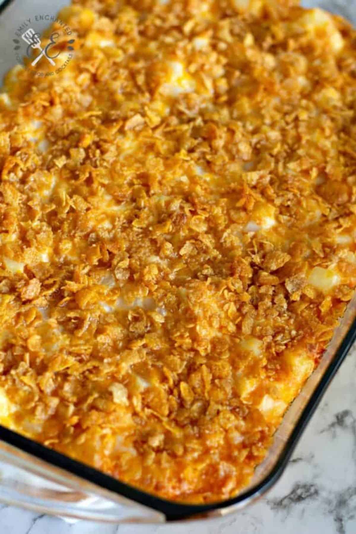 Delicious Funeral Potatoes in a glass casserole.
