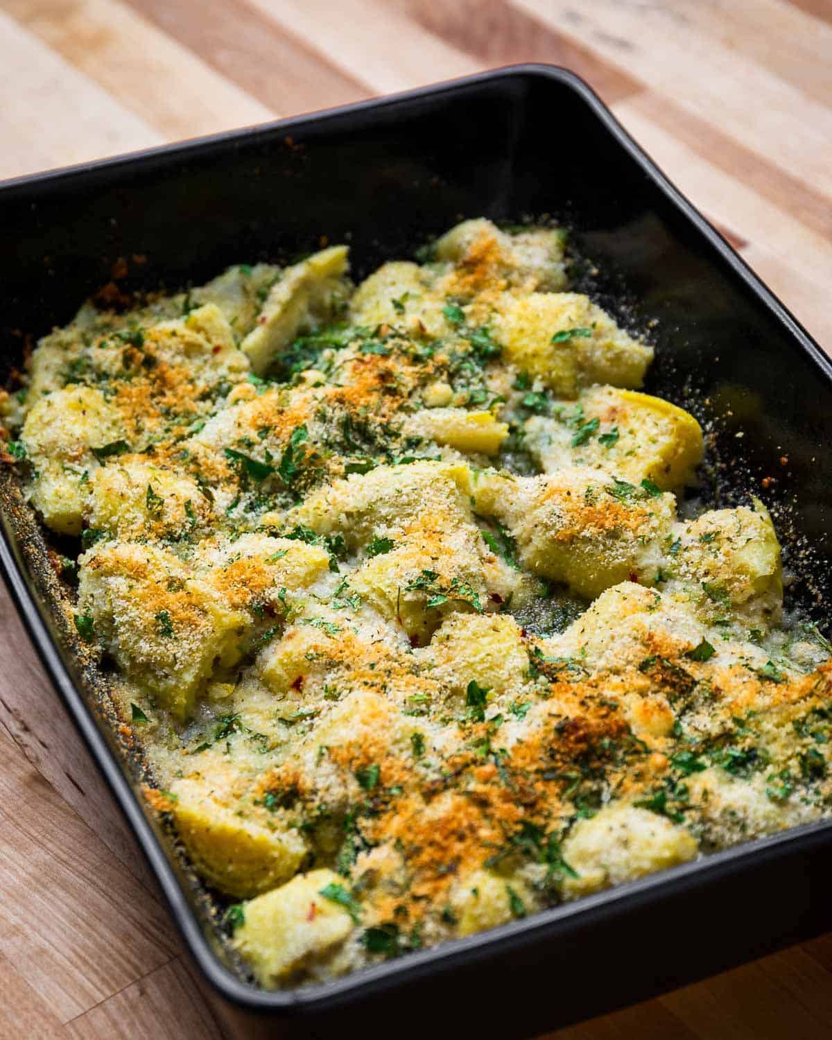 Tasty Baked Artichoke Hearts on a baking tray.