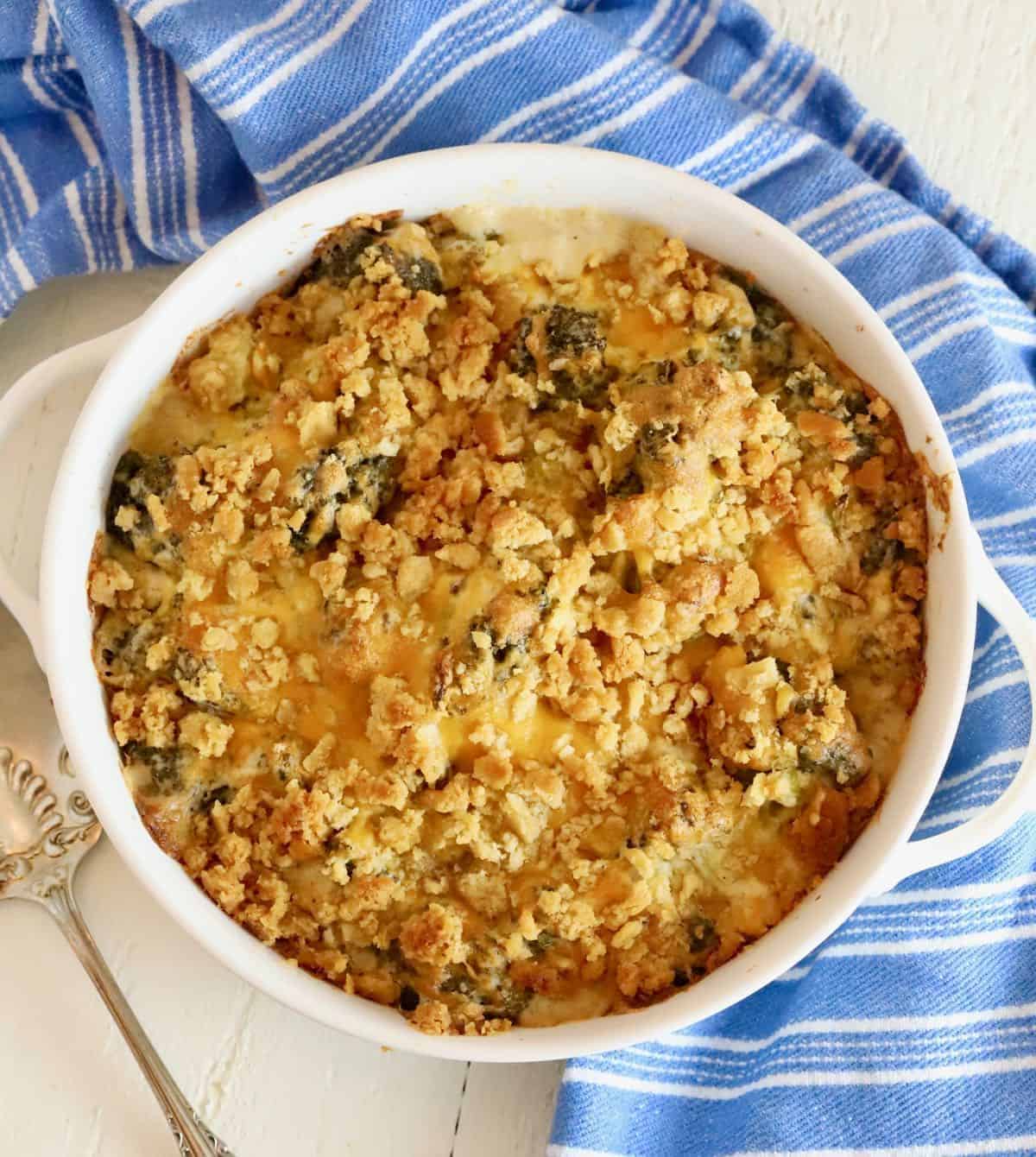Scrumptious Broccoli Cheese Casserole With Ritz Crackers in a white pot.