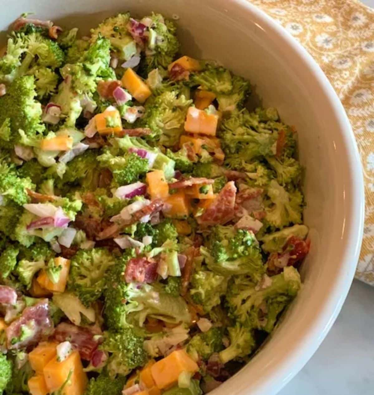 Healthy Southern Broccoli Salad in a white bowl.