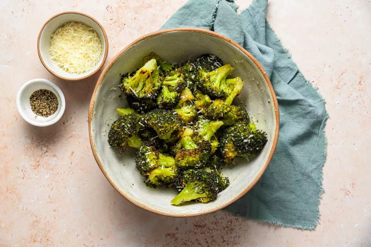 Flavorful Roasted Broccoli With Parmesan Cheese in a bowl.